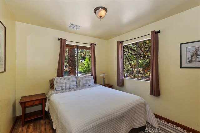 320 W Aeroplane Blvd, Big Bear City, CA 92314 - bedroom with wood finished floors and baseboards