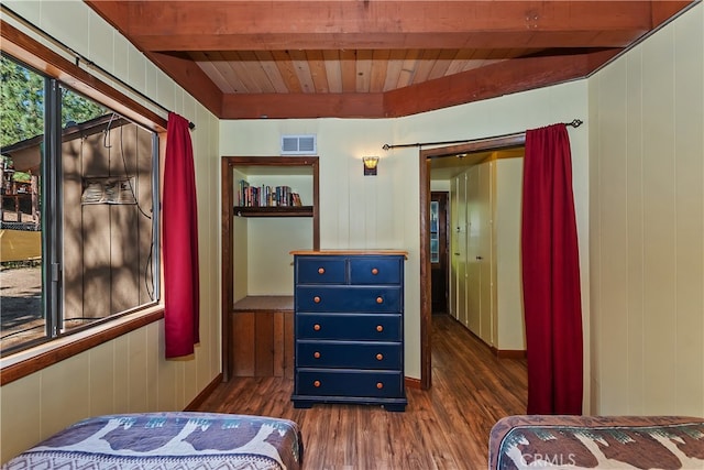 320 W Aeroplane Blvd, Big Bear City, CA 92314 - bedroom featuring dark wood-type flooring, wooden ceiling with exposed beams, and wood walls