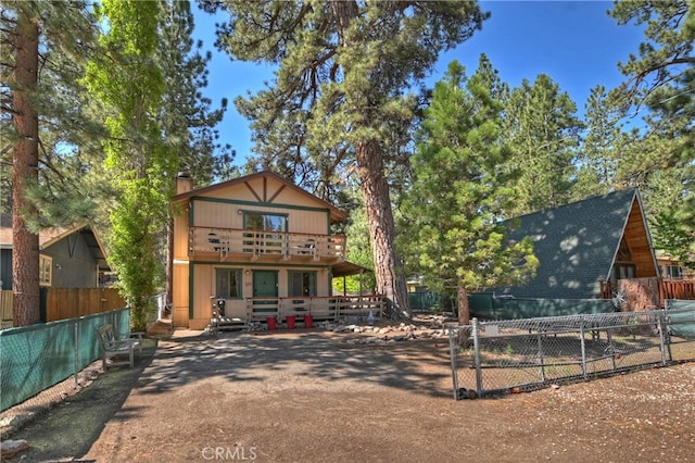 320 W Aeroplane Blvd, Big Bear City, CA 92314 - view of front facade featuring a balcony and a chimney