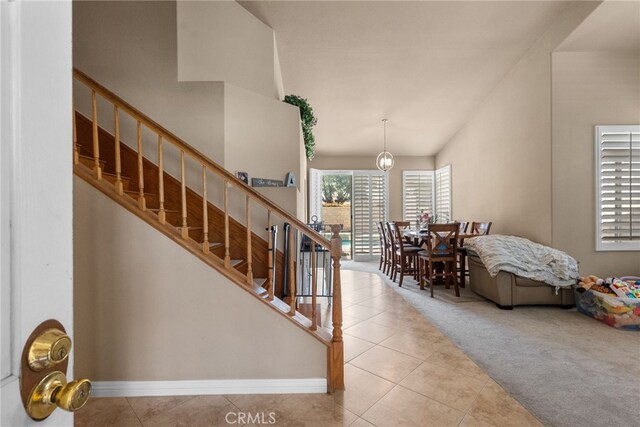 2330 Sycamore Ln, Palmdale, CA 93551 - stairs with carpet flooring, tile patterned flooring, and baseboards