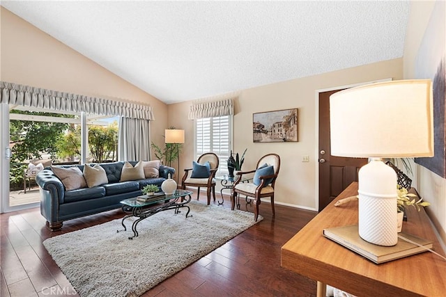 12670 Oxford Dr, La Mirada, CA 90638 - living area featuring dark wood-style floors, vaulted ceiling, baseboards, and a textured ceiling