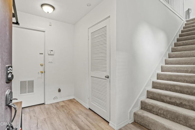 5321 Colodny Dr Unit 4, Agoura Hills, CA 91301 - foyer with light wood-type flooring, stairs, and baseboards