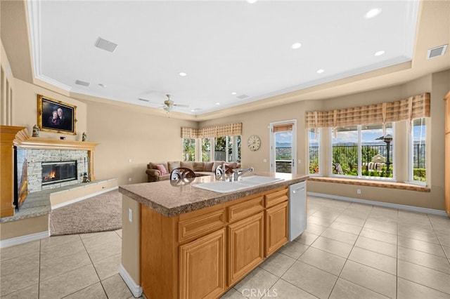 20130 Thagard Way, Yorba Linda, CA 92887 - kitchen with a raised ceiling, dishwasher, light tile patterned flooring, a fireplace, and ceiling fan