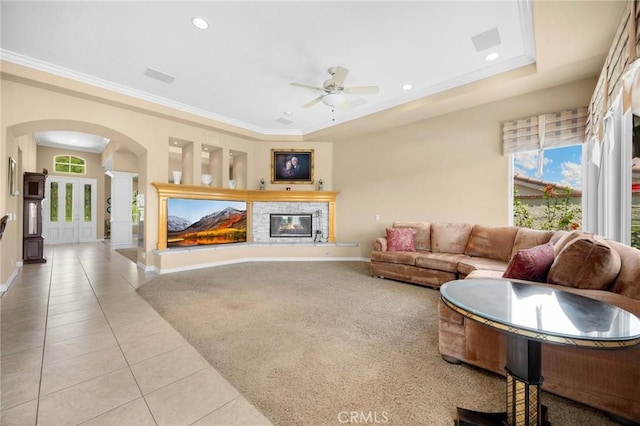 20130 Thagard Way, Yorba Linda, CA 92887 - living room with decorative columns, arched walkways, a glass covered fireplace, light tile patterned floors, and ceiling fan