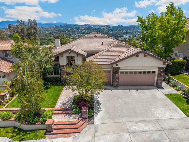 20130 Thagard Way, Yorba Linda, CA 92887 - single story home featuring an attached garage, stone siding, a tiled roof, and stucco siding