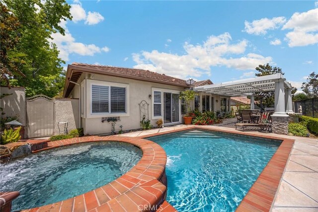 20130 Thagard Way, Yorba Linda, CA 92887 - view of swimming pool featuring a patio area, a gate, and a pool with connected hot tub