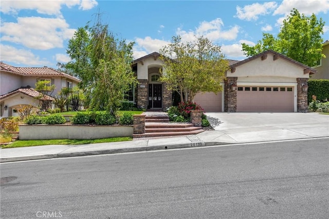 20130 Thagard Way, Yorba Linda, CA 92887 - view of front of house featuring stucco siding, a garage, concrete driveway, and stone siding