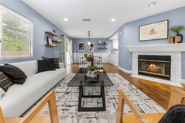 21124 Gladiolos Way, Lake Forest, CA 92630 - living room featuring recessed lighting, wood finished floors, a fireplace, and healthy amount of natural light