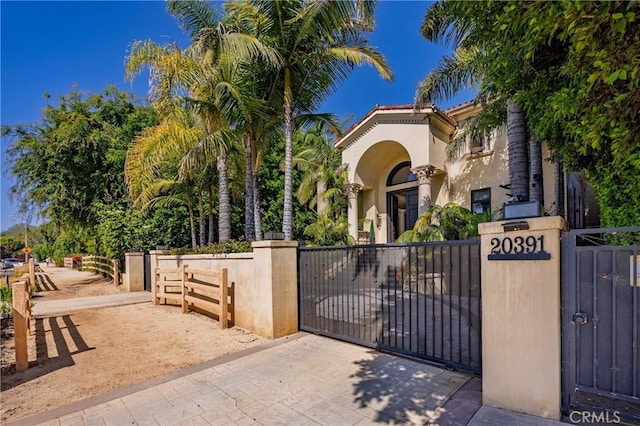 20391 Cypress St, Newport Beach, CA 92660 - mediterranean / spanish house with a gate and stucco siding