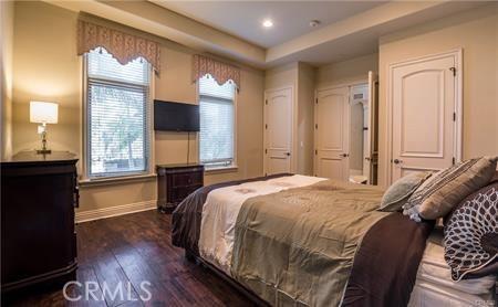 20391 Cypress St, Newport Beach, CA 92660 - bedroom with wood finished floors, a raised ceiling, and recessed lighting