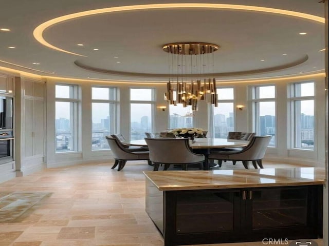 20391 Cypress St, Newport Beach, CA 92660 - dining space featuring a tray ceiling and a chandelier