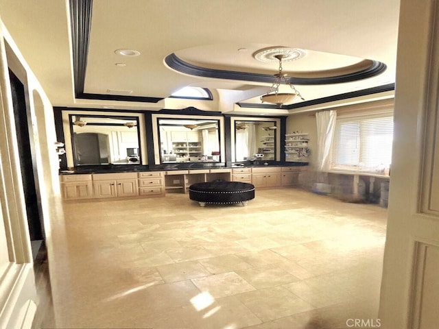 20391 Cypress St, Newport Beach, CA 92660 - bathroom featuring a raised ceiling, vanity, and stone finish floors