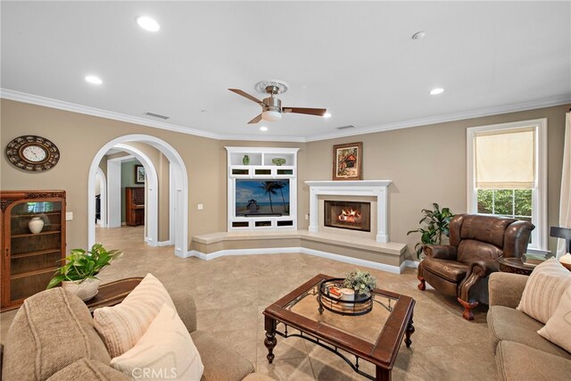 7 Illuminata Ln, Ladera Ranch, CA 92694 - living room with a ceiling fan, arched walkways, recessed lighting, ornamental molding, and built in shelves