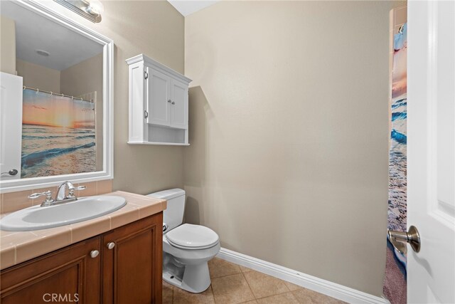7 Illuminata Ln, Ladera Ranch, CA 92694 - full bath featuring toilet, vanity, tile patterned flooring, and baseboards