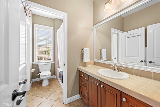 7 Illuminata Ln, Ladera Ranch, CA 92694 - full bath featuring vanity, toilet, baseboards, tile patterned flooring, and shower / bathtub combination with curtain