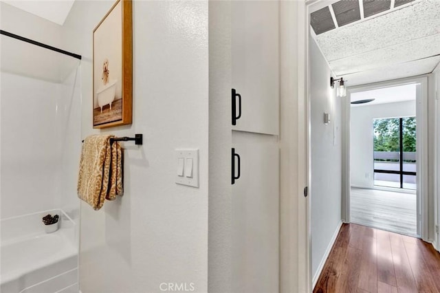 3062 Associated Rd Unit 9, Fullerton, CA 92835 - hall with dark wood-style flooring and baseboards