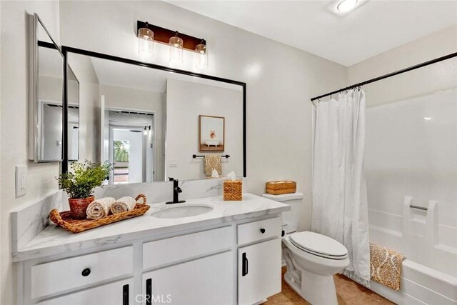3062 Associated Rd Unit 9, Fullerton, CA 92835 - bathroom with vanity, toilet, shower / bathtub combination with curtain, and tile patterned flooring