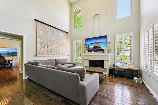 1623 Northhampton Dr, Riverside, CA 92506 - living room with a high ceiling, a fireplace, and dark wood-type flooring