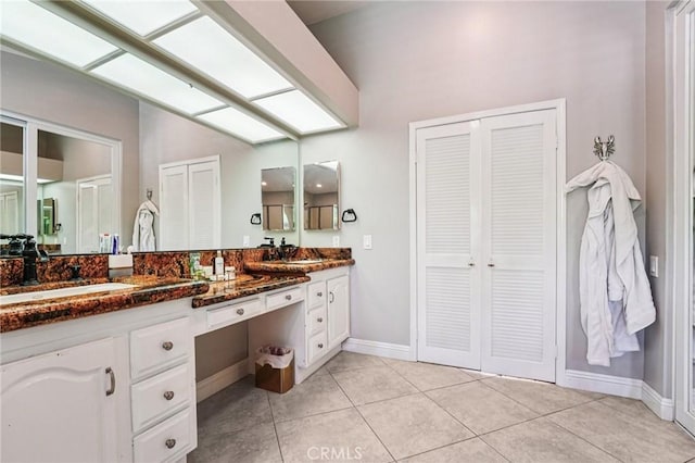 1623 Northhampton Dr, Riverside, CA 92506 - full bath featuring double vanity, a closet, and tile patterned flooring