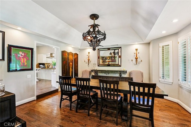1623 Northhampton Dr, Riverside, CA 92506 - dining space featuring a chandelier, hardwood / wood-style floors, a raised ceiling, and recessed lighting