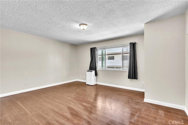 2018 Las Vegas, Pomona, CA 91767 - empty room with wood finished floors and a textured ceiling
