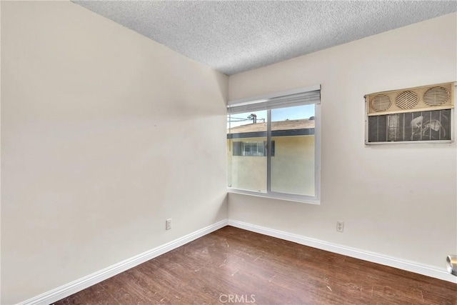 2018 Las Vegas, Pomona, CA 91767 - unfurnished room with dark wood-type flooring and a textured ceiling