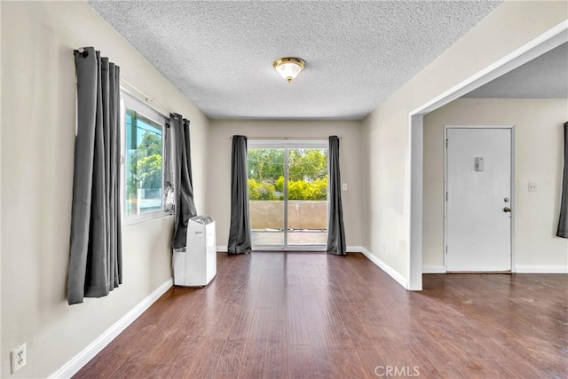 2018 Las Vegas, Pomona, CA 91767 - empty room featuring a textured ceiling and wood finished floors