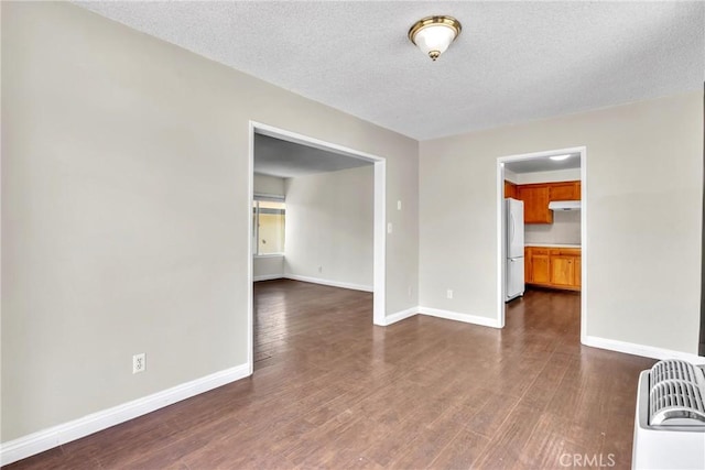2018 Las Vegas, Pomona, CA 91767 - empty room with dark wood-type flooring and a textured ceiling