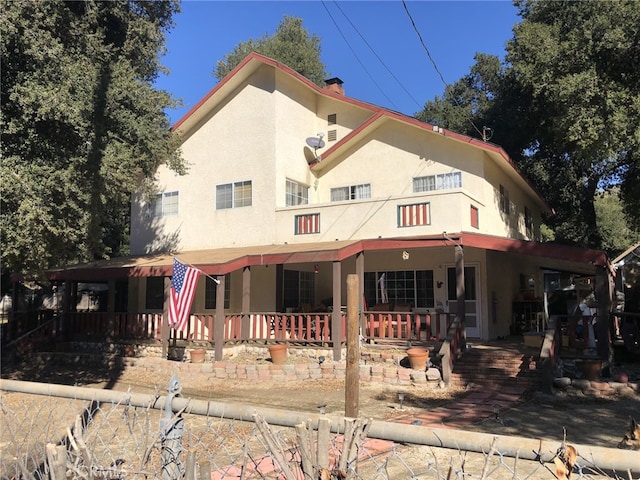 15215 Calle Verdad, Green Valley, CA 91390 - view of front of house with stucco siding, covered porch, and a chimney