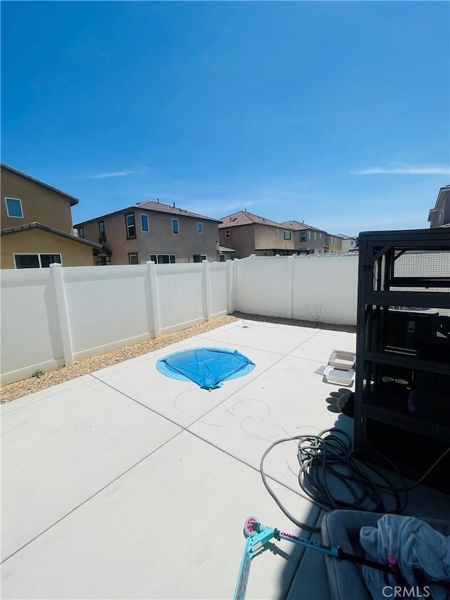 2518 Gunner Rdg, Rialto, CA 92377 - view of swimming pool with a fenced backyard, a patio, and a residential view