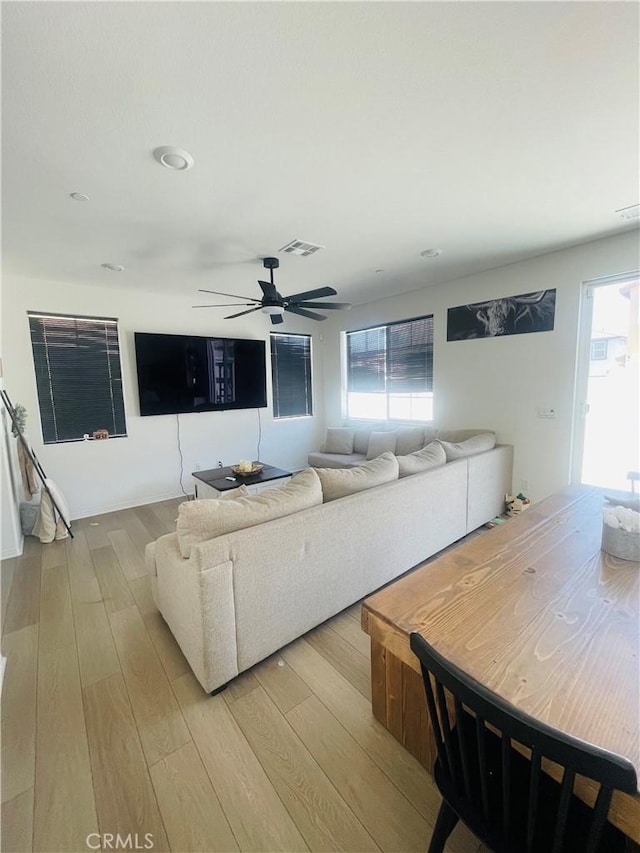 2518 Gunner Rdg, Rialto, CA 92377 - living area featuring light wood-style flooring and ceiling fan