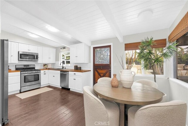 9 W Avenida Cornelio, San Clemente, CA 92672 - kitchen featuring stainless steel appliances, a sink, dark wood finished floors, white cabinetry, and butcher block countertops