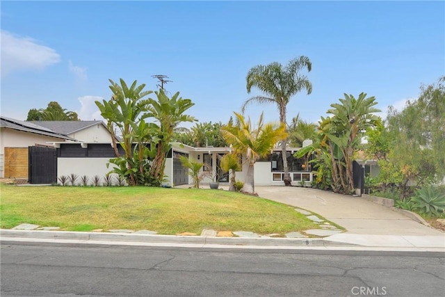 9 W Avenida Cornelio, San Clemente, CA 92672 - view of property hidden behind natural elements with a front lawn and stucco siding
