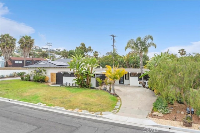 9 W Avenida Cornelio, San Clemente, CA 92672 - view of front of house featuring driveway, a front lawn, and stucco siding