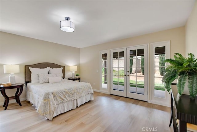 5697 Los Robles, La Verne, CA 91750 - bedroom with french doors, access to outside, light wood finished floors, and baseboards