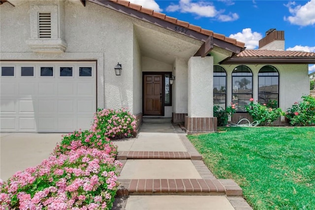 5697 Los Robles, La Verne, CA 91750 - property entrance with stucco siding, a chimney, a tiled roof, and a yard