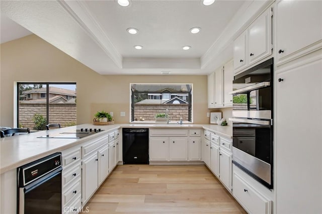 5697 Los Robles, La Verne, CA 91750 - kitchen with black appliances, light wood-type flooring, light countertops, recessed lighting, and white cabinetry