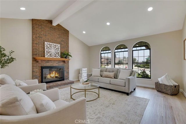 5697 Los Robles, La Verne, CA 91750 - living room with light wood-style flooring, a brick fireplace, recessed lighting, and baseboards