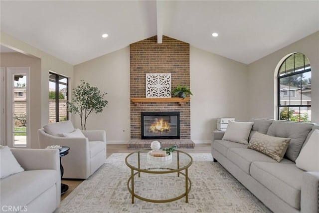 5697 Los Robles, La Verne, CA 91750 - living area with plenty of natural light, light wood-style flooring, a brick fireplace, and baseboards