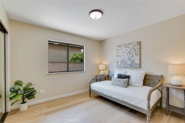 5697 Los Robles, La Verne, CA 91750 - bedroom featuring wood finished floors, baseboards, and a closet