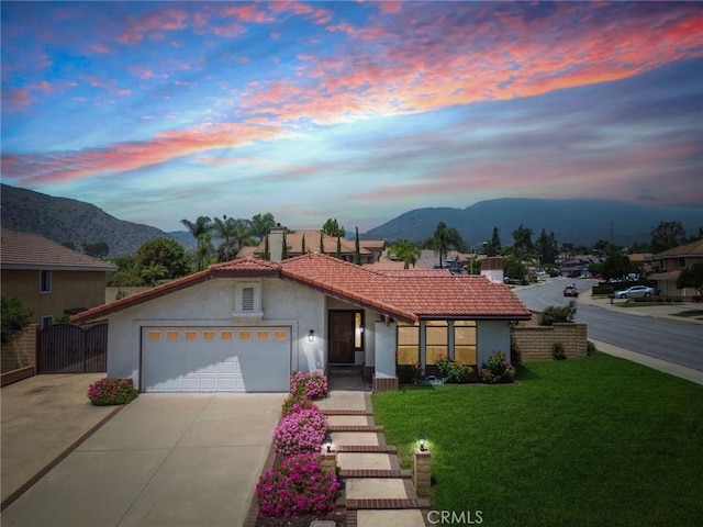 5697 Los Robles, La Verne, CA 91750 - view of front of home with a mountain view, stucco siding, driveway, a tile roof, and a front lawn