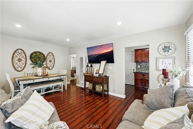 210 W Tichenor St, Compton, CA 90220 - living area with wood finished floors, recessed lighting, baseboards, and a heating unit