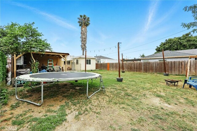 210 W Tichenor St, Compton, CA 90220 - view of yard with a trampoline
