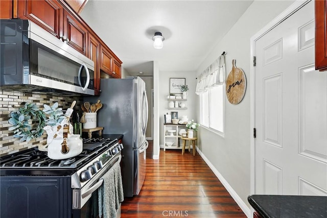 210 W Tichenor St, Compton, CA 90220 - kitchen with appliances with stainless steel finishes, reddish brown cabinets, tasteful backsplash, dark wood finished floors, and baseboards