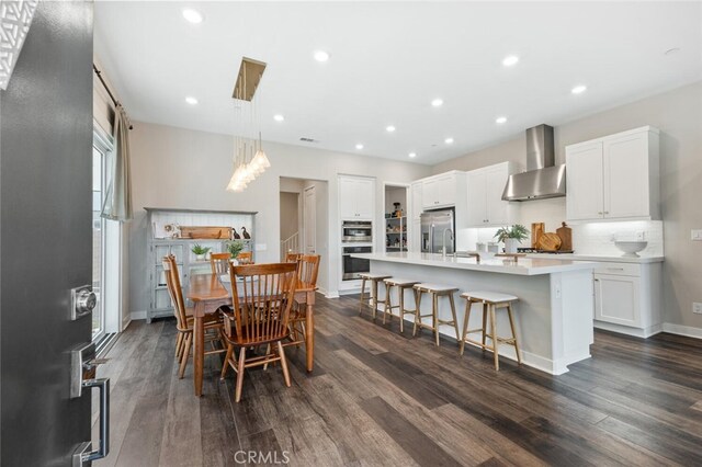 27227 Coyote Bush Ct, Valencia, CA 91381 - dining space featuring dark wood-style flooring, baseboards, and recessed lighting
