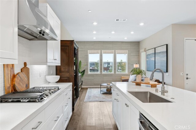 27227 Coyote Bush Ct, Valencia, CA 91381 - kitchen featuring ventilation hood, a sink, appliances with stainless steel finishes, light countertops, and recessed lighting