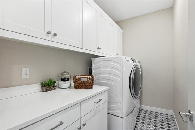 27227 Coyote Bush Ct, Valencia, CA 91381 - washroom featuring cabinet space, independent washer and dryer, and baseboards