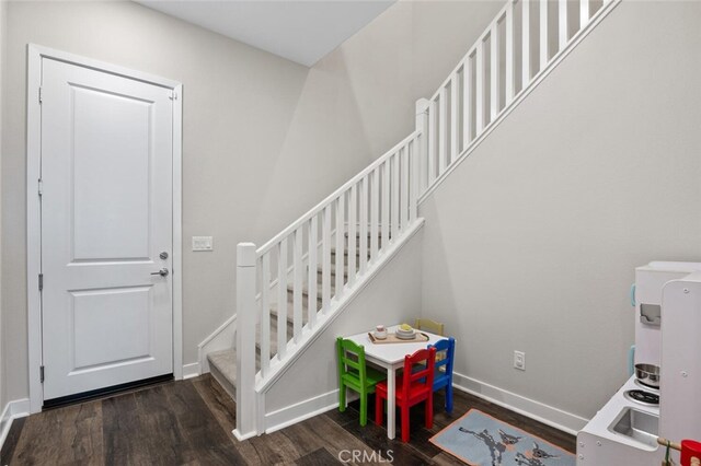 27227 Coyote Bush Ct, Valencia, CA 91381 - foyer featuring wood finished floors, stairway, and baseboards