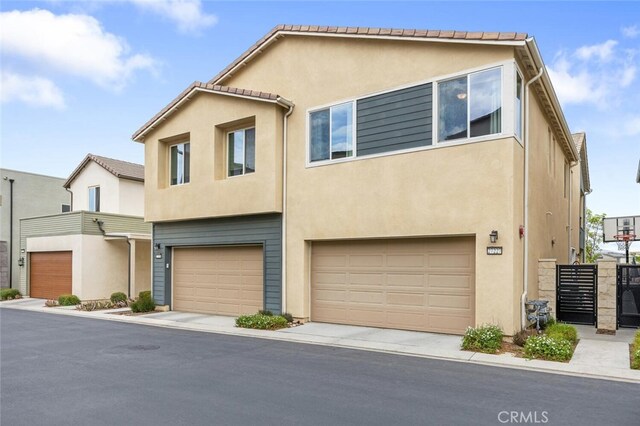 27227 Coyote Bush Ct, Valencia, CA 91381 - multi unit property with an attached garage and stucco siding