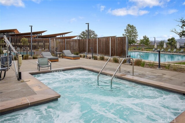 27227 Coyote Bush Ct, Valencia, CA 91381 - community pool featuring a patio